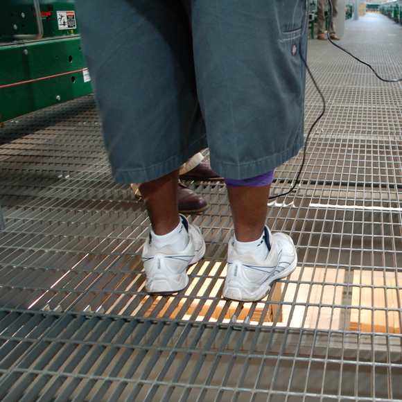 Standing on a bar grate floor